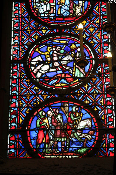 Mounted knights & foot soldier stained glass scenes at St Chapelle. Paris, France.
