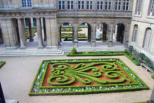 Low hedges formed into complex design in formal garden at Carnavalet Museum. Paris, France.