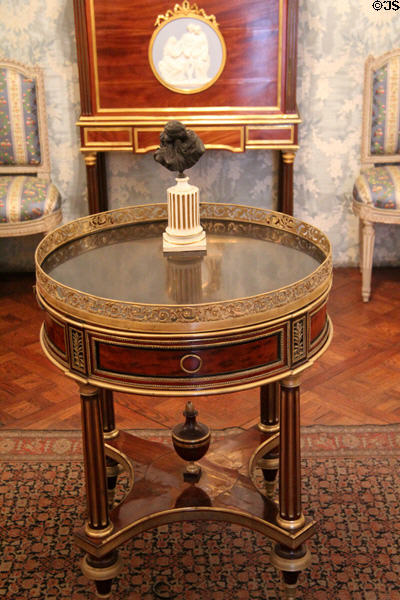 Mahogany center table with gilded bronze railing (c1785) by Gambier from Breteuil Hotel in Boudoir Louis XVI at Carnavalet Museum. Paris, France.