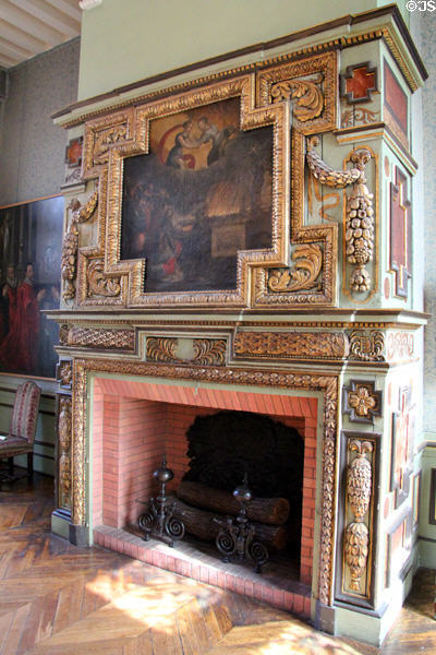 Ornate gilded mantel with painting at Carnavalet Museum. Paris, France.