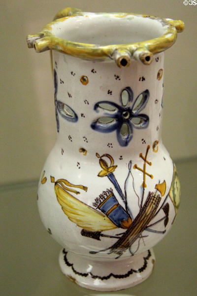Earthenware puzzle jug (c1791) painted with standard of unknown order & inscribed La Loi made by Faïence de Never at Carnavalet Museum. Paris, France.
