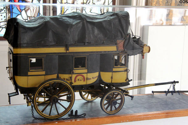 Small model of a stagecoach (c1830) advertising Laffite & Caillard which provided service between Paris & Strasbourg at Carnavalet Museum. Paris, France.