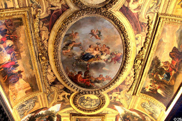 Crowning of Venus baroque ceiling painting (1683) by René-Antoine Houasse in Venus room at Versailles Palace. Versailles, France.