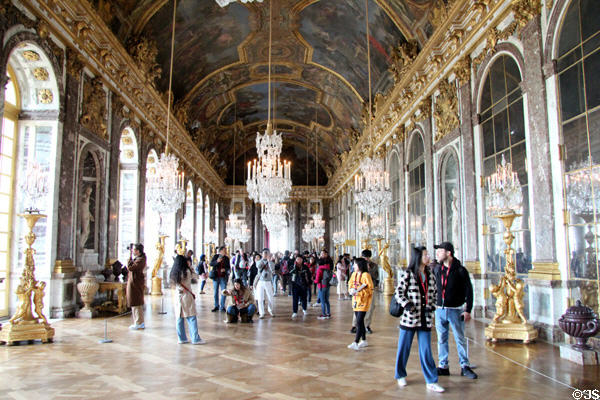 Visitors in Hall of Mirrors at Versailles Palace. Versailles, France.