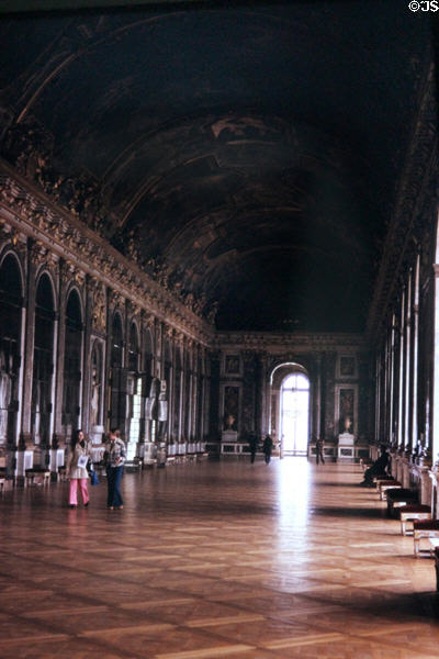 Visitors in Hall of Mirrors at Versailles Palace. Versailles, France.