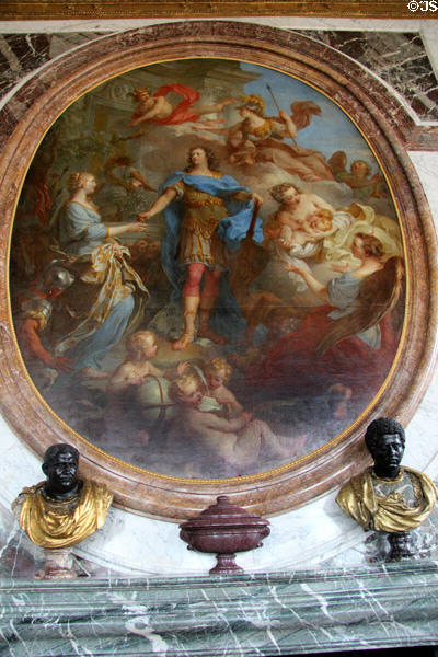 Symbols of peace under Louis XIV oval mural (c1686) by Charles Le Brun over marble fireplace mantle with Roman busts in Peace Room at Versailles Palace. Versailles, France.