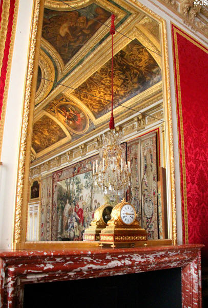 Mirror & mantle clock in Queen's Royal Table Antechamber at Versailles Palace. Versailles, France.