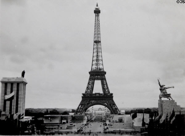 Eiffel Tower between tall German & USSR pavilions seen from Trocadero at Exposition Paris 1937. Paris, France.