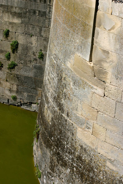 Massive wall over moat from former stronghold of Château de Chantilly. Chantilly, France.