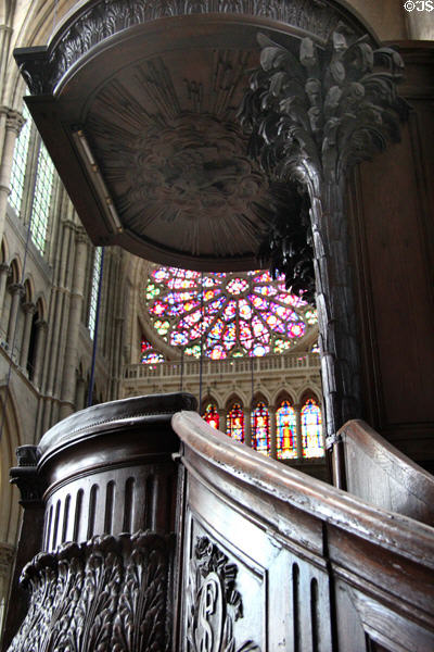 Pulpit with rose window in background in Reims Cathedral. Reims, France.