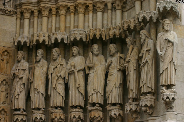 Saints carved to right of central portal of Amiens Cathedral. Amiens, France.