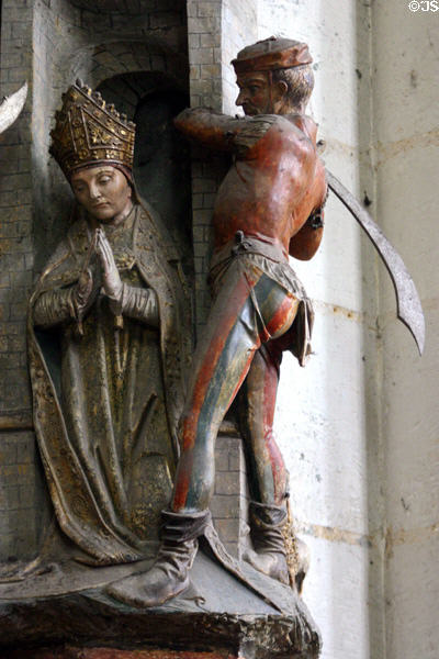 Sculpture of Bishop being beheaded at Amiens Cathedral. Amiens, France.