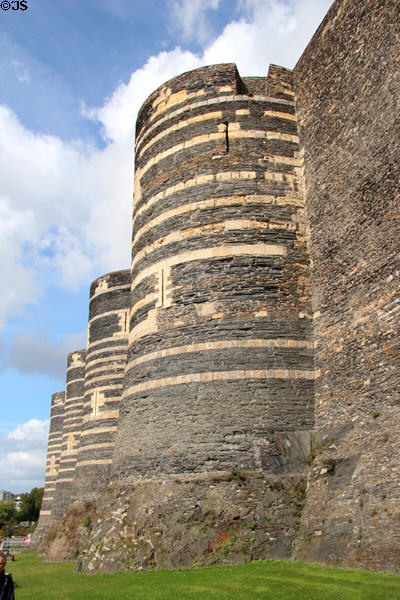 Rows of striped towers at Angers Chateau. Angers, France.