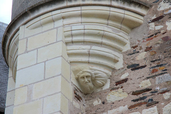 Sculpted face on facade of fortified gateway at Angers Chateau. Angers, France.
