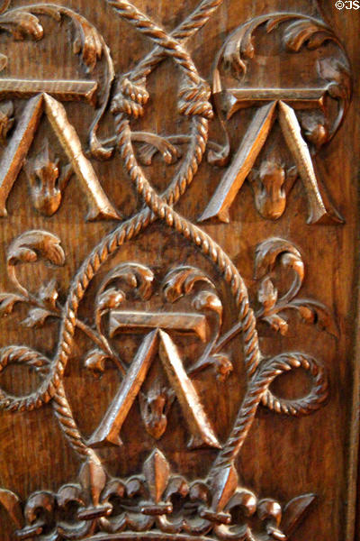 Detail of fine carving of royal emblems on wooden chest in Drummers' Room of Royal Lodge at Chateau Royal of Amboise. Amboise, France.