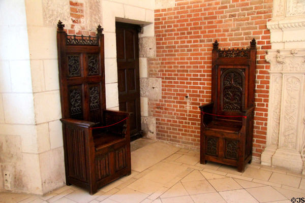 Wooden chairs with richly decorated high backs in Council Chamber in Royal Lodge at Chateau Royal of Amboise. Amboise, France.