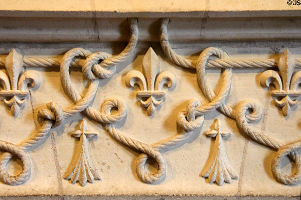 Corded belt heraldic symbol in reference to St Francis of Assisi on fireplace in Franciscan Antechamber in Royal Lodge at Chateau Royal of Amboise. Amboise, France.