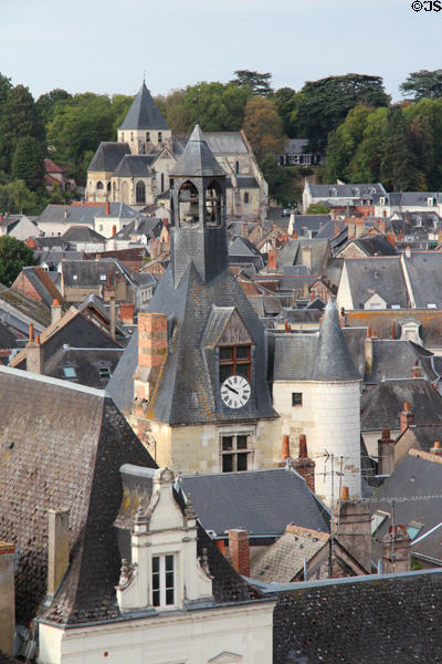 Clock tower (14C) & St Denis church (12C) among roofs of old town. Amboise, France.