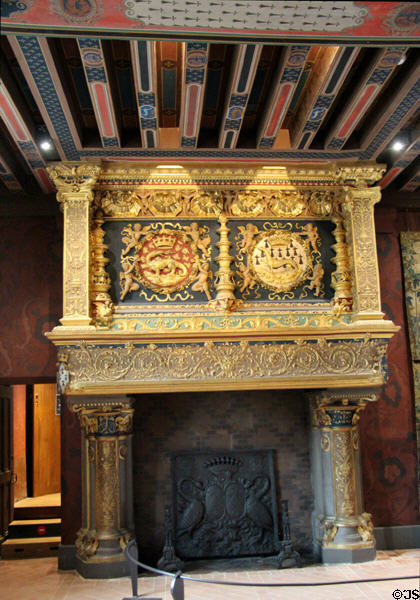 Renaissance fireplace detail of François I salamander & Queen Claude de France ermine crests in François I Renaissance wing at Blois Chateau. Blois, France.