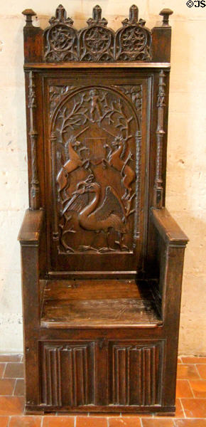 Renaissance high-backed chair (1st quarter 16thC) carved with unicorns & heron swallowing eel in Catherine de Medici bedroom at Chaumont-Sur-Loire. France.