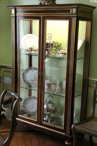 Display case with porcelain & silver in family dining room at Cheverny Chateau. Cheverny, France.