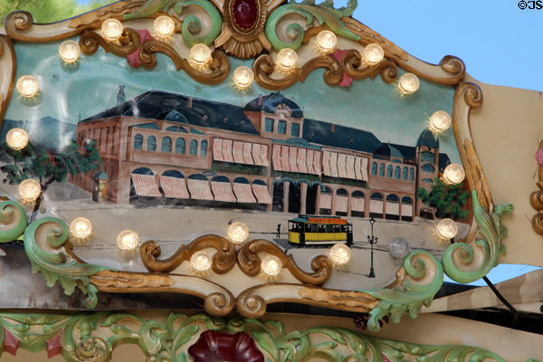 Painting of street car in front of old building in carousel in Jardin Albert 1er, Promenade du Paillon. Nice, France.