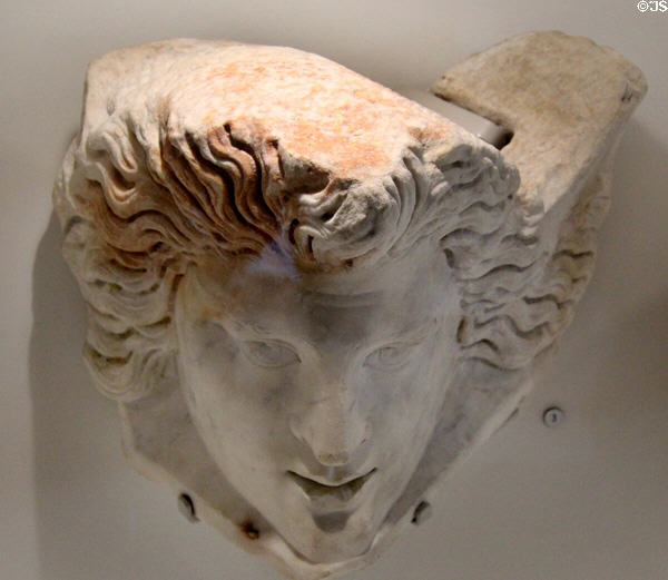 Roman marble sarcophagus corner with comedic theater face (2nd-3rd C) at Musée de la Romanité. Nimes, France.