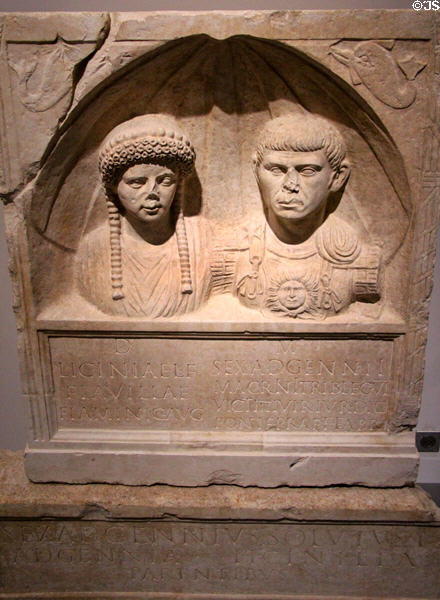 Roman marble stele with figures & epitaph of Licinia Flavilla & Sextus Adgennius Macrinus (end 1st - early 2ndC) from Nimes house beside amphitheater at Musée de la Romanité. Nimes, France.