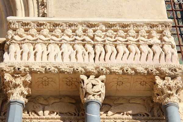 Row of chained sinners going to hell in Last Judgment scene carved to right of portal of St Trophime church. Arles, France.