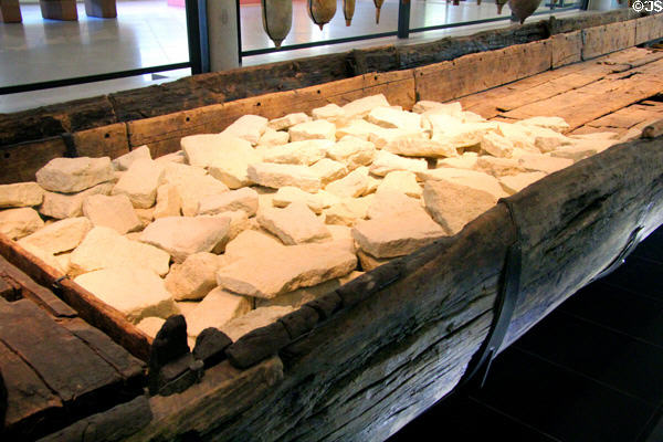 Wreck of Roman barge (Arles-Rhone 3) displayed with cargo of rocks at Arles Antiquities Museum. Arles, France.