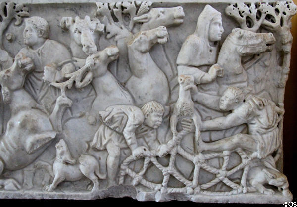 Detail of hunting with nets on carved hunting scene on Roman-era marble sarcophagus (3rdC) at Arles Antiquities Museum. Arles, France.