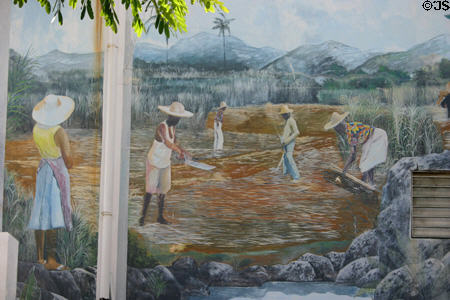 Mural of sugar cane cutters in garden of Anchorage hotel. Pointe-à-Pitre, Guadeloupe.