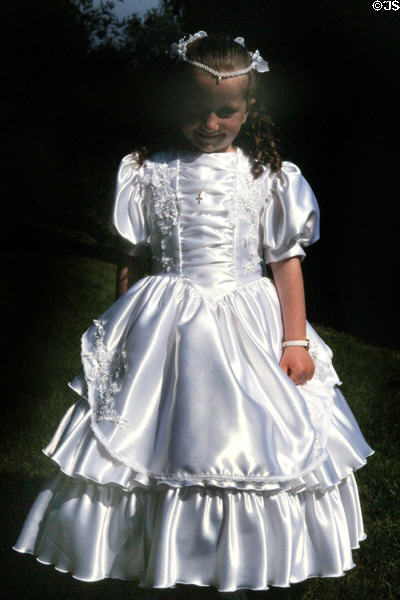 Young girl in first communion dress in Cork. Ireland.