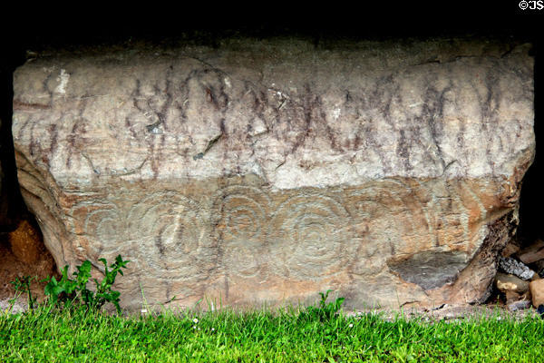 Neolithic carved stone with circular design at Knowth. Ireland.