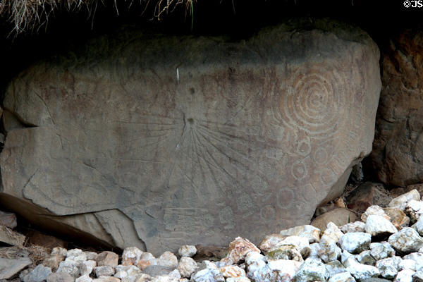 Neolithic carved stone with sundial-like design at Knowth. Ireland.