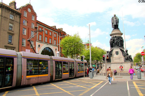 O'Connell Street tram mall with Daniel O'Connell Monument. Dublin, Ireland.