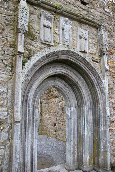 Carvings of priests over doorway at Clonmacnoise. Ireland.