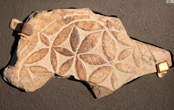 Grave slab with flower-like pattern at Clonmacnoise museum. Ireland.