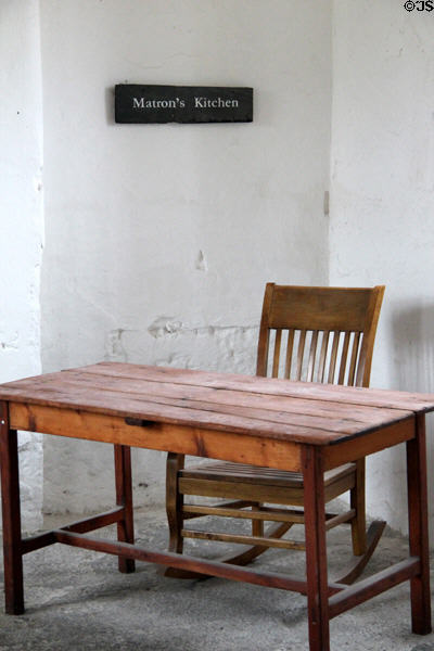 Wooden table & chair in Matron's kitchen at Irish Workhouse Centre. Portumna, Ireland.