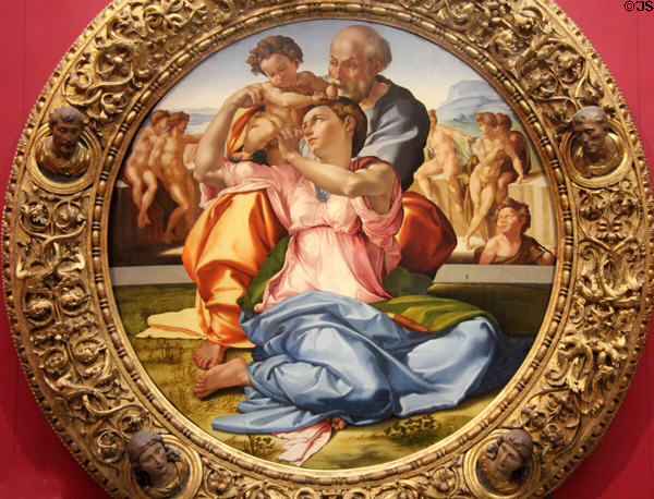 Holy Family with Infant St John the Baptist painting (1507?) by Michelangelo Buonarroti at Uffizi Gallery. Florence, Italy.