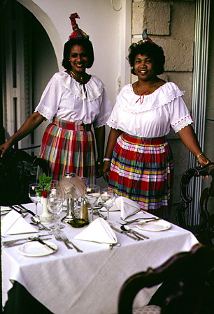 Traditional dress of servers at the Great House Restaurant on Gros Islet. St Lucia.