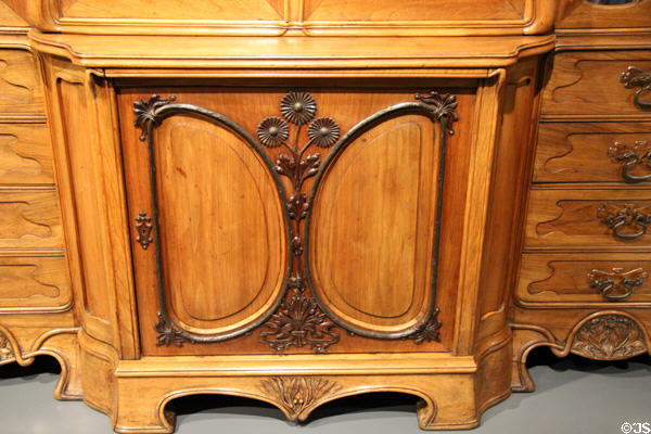 Detail of walnut & oak bookcase (early 20thC) in Art Nouveau style at National Museum of History & Art. Luxembourg, Luxembourg.