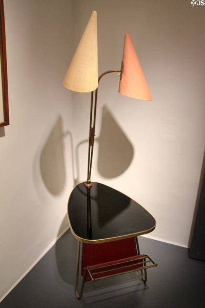 Newspaper table with two lamps (1960) made of beech plywood, brass & synthetic materials at National Museum of History & Art. Luxembourg, Luxembourg.