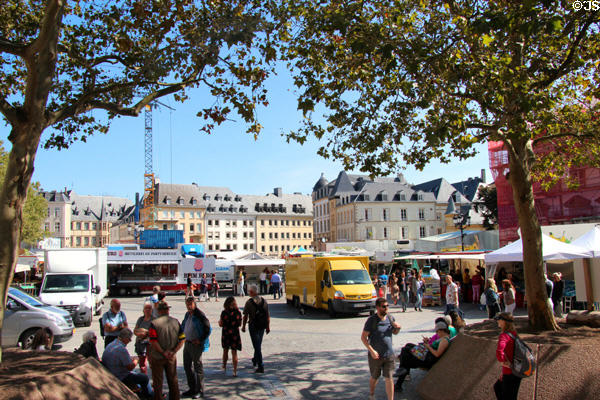 Market stalls & shoppers in Place Guillaume II. Luxembourg, Luxembourg.