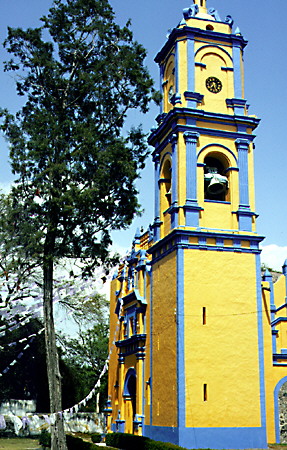 Yellow & blue stucco colors a church in Cholula. Mexico.