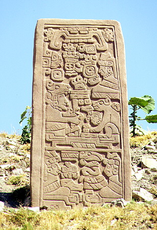 Stella carved with reliefs of figures & animals in Monte Albán in hills above Oaxaca. Mexico.