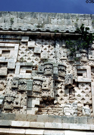 Row of Chac masks & geometric patterns on frieze of Governor's Palace at Uxmal. Mexico.