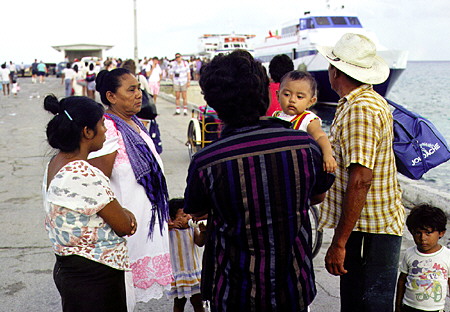 Native Mexican family on docks of Cozumel. Mexico.