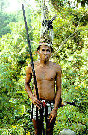 Hunter with blowgun at Ugat longhouse in Sarawak. Malaysia.