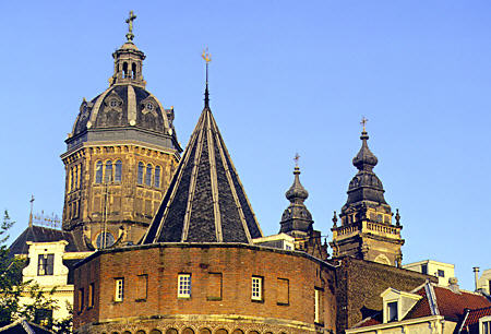 Conical roof of Schreierstoren & nearby church dates from 1480 & is part of Medieval walls. Amsterdam, Netherlands.